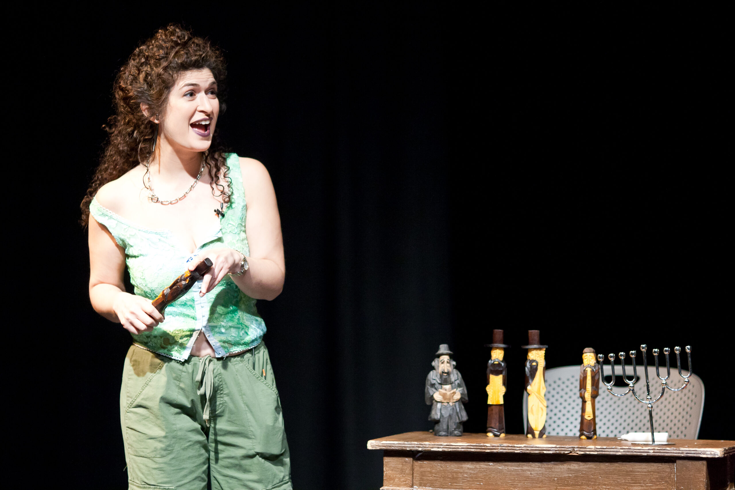 Image of an actor in Yiddish theater, in a green dress shirt
